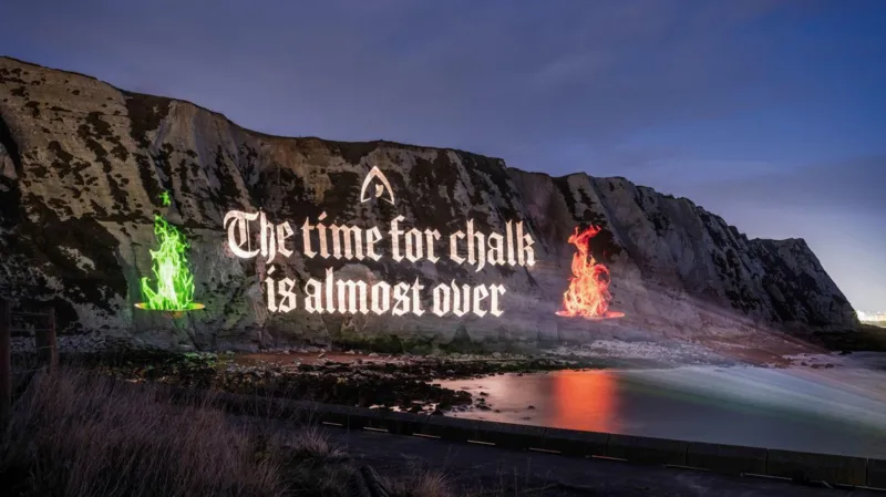 The Traitors projection on the White Cliffs of Dover ahead of the show’s finale, featuring firepits, iconic quotes